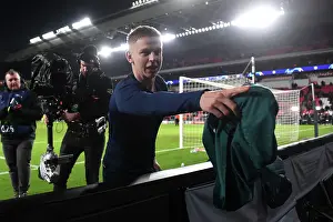 PSV Eindoven V Arsenal 2023-24 Prints: Arsenal's Zinchenko Gifts Shirt to Ecstatic Fan after PSV Victory - UEFA Champions League 2023/24