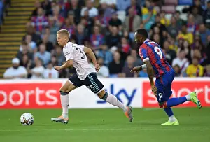 Arsenal's Zinchenko Outmaneuvers Crystal Palace's Ayew in Premier League Clash