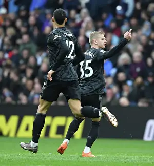 Arsenal's Zinchenko and Saliba Celebrate Goal Against Aston Villa in Premier League Clash (2022-23)