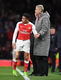 Arsenal V Leicester City 2016-17 Prints: Arsene Wenger and Alexis Sanchez: A Focused Duo During Arsenal's Battle Against Leicester City (2016-17)
