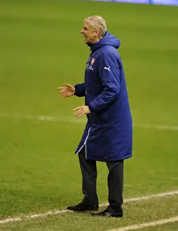 Arsene Wenger at Anfield: A Clash of Premier League Titans (Liverpool vs. Arsenal, 2014)