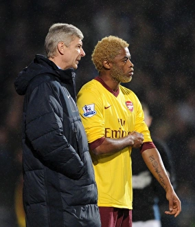 Ipswich Town v Arsenal Carling Cup 2010-11 Collection: Arsene Wenger the Arsenal Manager with Alex Song. Ipswich Town 1: 0 Arsenal