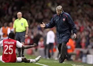 Images Dated 7th March 2007: Arsene Wenger the Arsenal manager celebrates Arsenals goal with Emmanuel Adebayor