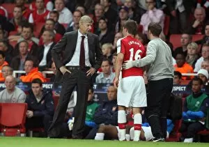 Arsenal v Celtic 2009-10 Collection: Arsene Wenger the Arsenal Manager chats to Aaron Ramsey