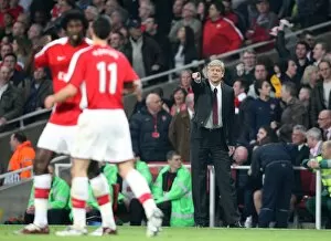 Arsene Wenger the Arsenal Manager passes on some instructions