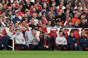 Images Dated 31st October 2009: Arsene Wenger the Arsenal Manager seats in the dug