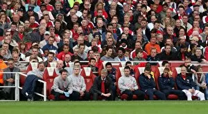 Arsene Wenger the Arsenal Manager seats in the dug