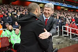 Arsene Wenger the Arsenal Manager shakes hands with Josep Guardiola the Barcelona Manager before the match. Arsenal 2: 2 Barcelona. UEFA Champions League. Quarter Final, 1st Leg. Emirates Stadium, 31 / 3 / 10. Credit : Arsenal Football Club /