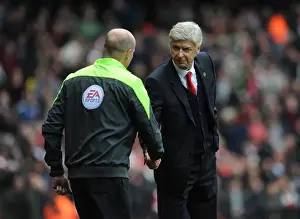 Arsene Wenger the Arsenal Manager shakes hands with Lee Mason the Fourth Official before the match