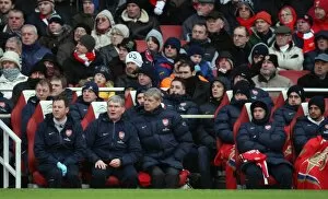 Arsenal v Everton 2009-10 Gallery: Arsene Wenger the Arsenal Manager sits in the dug out with Pat Rice (Assistant)