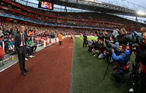 Arsenal v Celtic 2009-10 Collection: Arsene Wenger the Arsenal Manager stands infront of the photographers