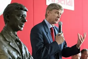 Images Dated 18th October 2007: Arsene Wenger the Arsenal Manager stands near his bust