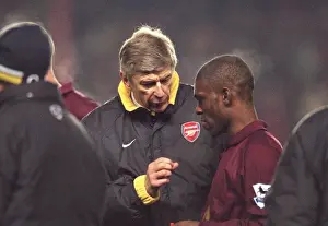Arsene Wenger the Arsenal manager talks to Kerrea Gilbert (Arsenal) before the start of extra time