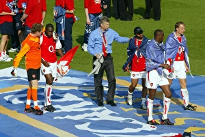 Images Dated 25th September 2002: Arsene Wenger the Arsenal Managertalks to Ashley Cole at the end of the match