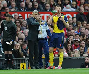 Manchester United V Arsenal 2014-15 Prints: Arsene Wenger Coaching Per Mertesacker at Old Trafford (2014-15)