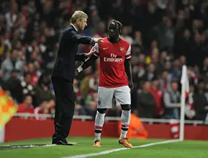 Arsenal V Napoli 2013-14 Prints: Arsene Wenger Conferring with Bacary Sagna during Arsenal vs Napoli