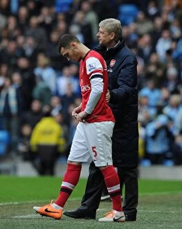 Manchester City v Arsenal 2013-14 Collection: Arsene Wenger Consoles Sub Thomas Vermaelen during Manchester City vs. Arsenal (2013-14)