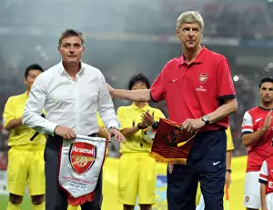 Nagoya Grampus V Arsenal 2013-14 Prints: Arsene Wenger and Dragan Stojkovic Exchange Pennants Before Nagoya Grampus vs