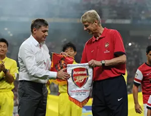 Nagoya Grampus V Arsenal 2013-14 Prints: Arsene Wenger and Dragan Stojkovic Exchange Pennants during Nagoya Grampus vs