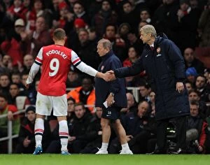 Crystal Palace Collection: Arsene Wenger and Lukas Podolski: A Handshake at Emirates Stadium (Arsenal vs Crystal Palace)