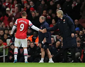 Arsenal V Crystal Palace 2013-14 Prints: Arsene Wenger and Lukas Podolski: A Handshake at Emirates Stadium (Arsenal vs Crystal Palace)