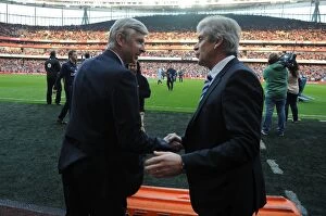 Images Dated 29th March 2014: Arsene Wenger and Manuel Pellegrini: A Pre-Match Encounter between Arsenal and Manchester City