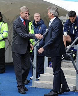 Manchester City v Arsenal 2013-14 Collection: Arsene Wenger and Manuel Pellegrini's Pre-Match Handshake (2013-14) - Manchester City vs. Arsenal
