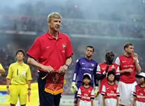 Nagoya Grampus V Arsenal 2013-14 Prints: Arsene Wenger with Nagoya Grampus Pennant before Arsenal's 2013 Pre-season Match