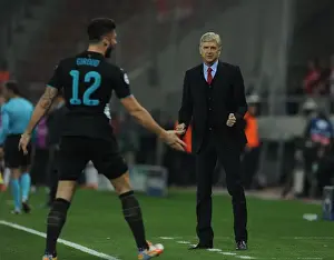 Arsene Wenger and Olivier Giroud: Celebrating Arsenal's Third Goal Against Olympiacos in the Champions League (December 2015)