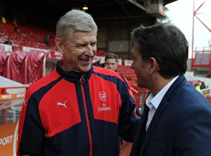 Nottingham Forest V Arsenal EPL Cup 3rd Round 2016-17 Prints: Arsene Wenger and Philippe Montanier: A Pre-Match Encounter at Nottingham Forest vs Arsenal (EFL Cup)