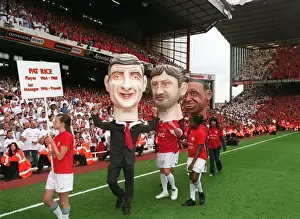 The Arsene Wenger and Tony Adams giant heads on the pitch during the final salute parade
