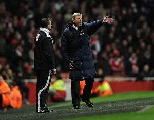 Images Dated 16th April 2012: Arsene Wenger vs. Kevin Friend: Intense Argument during Arsenal vs. Wigan Athletic (2011-12)