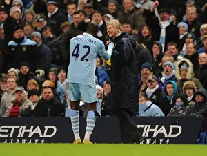 Manchester City V Arsenal 2011-12 Prints: Arsene Wenger and Yaya Toure: A Moment of Camaraderie Amidst Rivalry (Manchester City vs Arsenal)