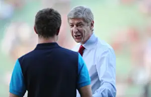 Arsene Wenger's Light-Hearted Moment with Aaron Ramsey during Udinese v Arsenal, UEFA Champions League Play-Off (2011)