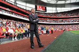Arsenal v Liverpool 2011-2012 Collection: Arsene Wenger's Struggle: Arsenal's Defeat to Liverpool (2011)