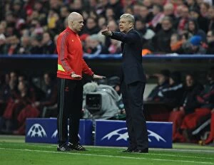 Images Dated 11th March 2014: Arsene Wenger's Tense Clash with Referees during Arsenal's UEFA Champions League Match at Bayern