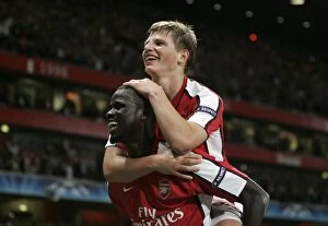 Eboue Emmanuel Collection: Arshavin and Eboue: Celebrating Arsenal's 2-0 Victory Over Olympiacos in the Champions League
