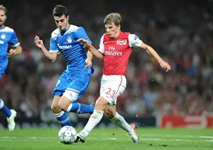 Arsenal V Olympiacos 2011-12 Prints: Arshavin vs Marcano: A Battle in the Arsenal-Olympiacos UEFA Champions League Clash