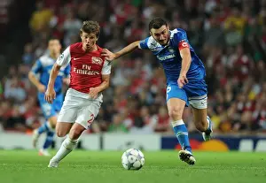 Arsenal V Olympiacos 2011-12 Prints: Arshavin vs. Torossidis: A Battle in the Arsenal-Olympiacos UEFA Champions League Clash