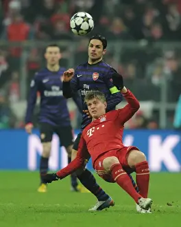 Bayern Munich V Arsenal 2012-13 Prints: Arteta vs. Kroos: A Champions League Showdown at Allianz Arena