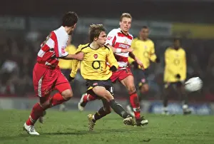 Arturo Lupoli (Arsenal) Ricky Ravenhill (Doncaster)