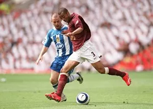 Images Dated 30th May 2006: Ashley Cole (Arsenal) David Thompson (Wigan). Arsenal 4: 2 Wigan Athletic