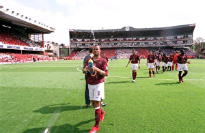 Images Dated 11th May 2006: Ashley Cole (Arsenal) squirts water before the match