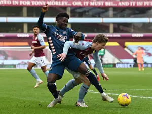 Aston Villa V Arsenal 2020-21 Prints: Aston Villa vs Arsenal: Bukayo Saka Faces Off Against Matt Targett