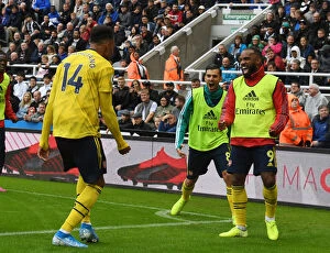 Images Dated 11th August 2019: Aubameyang and Lacazette Celebrate Goal: Newcastle United vs. Arsenal FC, Premier League 2019-20