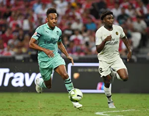 Aubameyang Outsmarts Mbe Soh: Thrilling Showdown Between Arsenal's Star Striker and PSG's Defender in International Champions Cup Clash