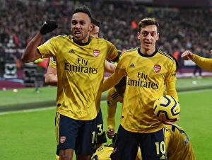 Images Dated 9th December 2019: Aubameyang and Ozil Celebrate Arsenal's Goals Against West Ham United (2019-20)