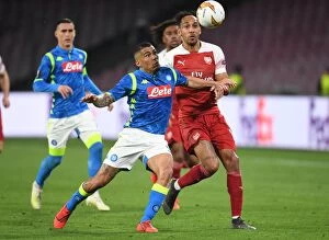 Napoli v Arsenal 2018-19 Collection: Aubameyang vs. Allan: Intense Clash in Napoli's Stadio San Paolo - Arsenal vs