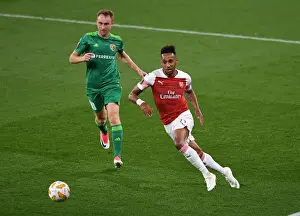 Arsenal V FC Vorskla Poltava 2018_19 Prints: Aubameyang vs. Kobakhidze: A Tense Face-Off in Arsenal's Europa League Clash