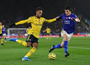 Leicester City V Arsenal 2019-20 Prints: Aubameyang vs Soyuncu: Intense Heading Battle in Leicester City vs Arsenal FC